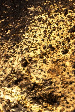 Altın taş dokunun arkaplanının görünümünü kapat