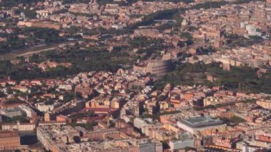 Aerial of Rome, Italy with river Tiber visible. Landscape day view of the historic center with city landmarks, including The Roman Forum and The Colosseum.