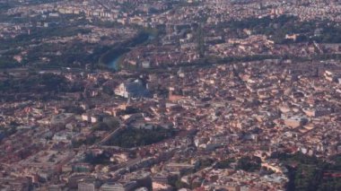 Aerial of Rome, Italy with river Tiber visible. Landscape day view of the historic center with city landmarks, including The Pantheon, Altare della Patria and The Colosseum.
