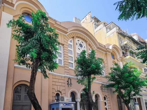 stock image Thessaloniki, Greece - June 30 2023: Low-angle of the facade of 1920s Monasteriotes Jewish Synagogue, the only one to have survived the Holocaust.