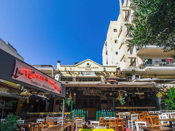 stock image Thessaloniki, Greece - June 30 2023: Day view of the empty traditional outdoor seating area of taverns with colorful chairs, tables and vintage decoration at the historic Bit Bazaar area.