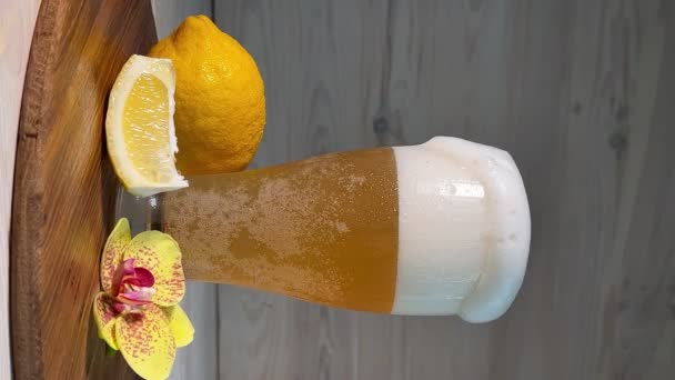 Glass Light Beer Beer Foam Flowing White Wooden Background Lemon — Stock Video