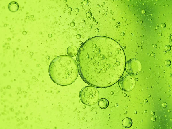 stock image Oil bubbles close-up macro on a green background