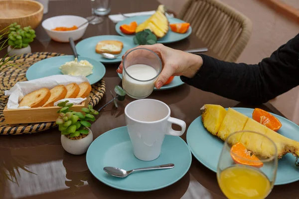 Homemade breakfast with pineapple butter, coffee and juice in the outdoor area in the morning