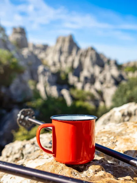 stock image Close-up of a cup of tea or coffee over an out of focus mountain landscape. Concept of hiking