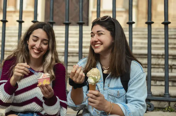 Two Caucasian Girls Sitting Staircase Eating Ice Cream Chatting Smiling — Stock Photo, Image