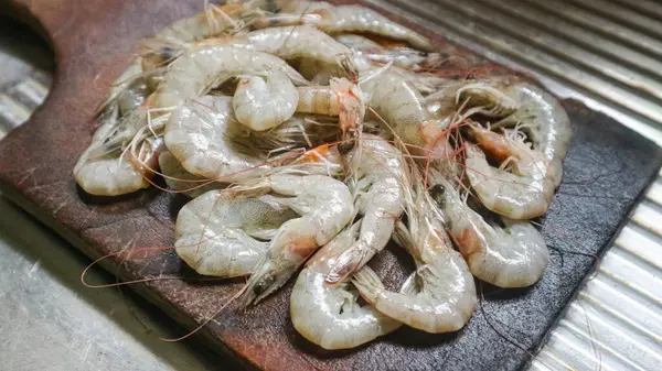 Fresh prawn cleaned on cutting board. Raw shrimps are healthy seafood