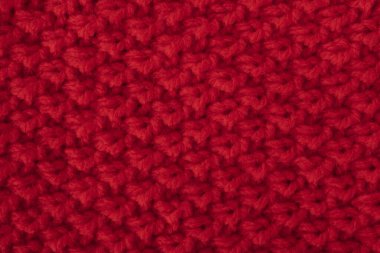 örülmüş yün arka planı koyu kırmızı renkte