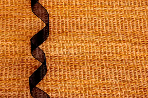 Rolled Black Ribbon Orange Textures Background Halloween Concept — Stock Photo, Image