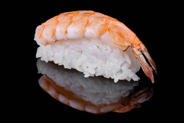 Fresh Shrimp Sushi on black concrete background. Nigiri or Sashimi. 