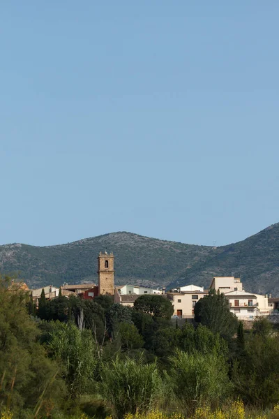 Stock image Landscape with the bell tower of Alcocer de Planes from the Serpis river basin, Spain