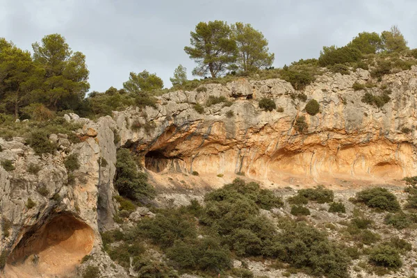 Landscape with the caves and rock paintings of La Sarga in Alcoi, Spain