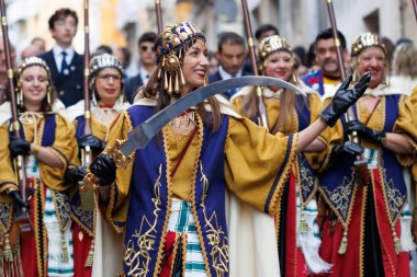 Alcoy, Spain, 04-20-2024: Moors and Christians, parade Diana Fila Ligeros with their squad corporal clipart