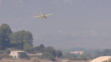 Beniarres, Spain, 07-31-2024; Seaplane approach to the waters of the Beniarres reservoir in aerial support of the forest fires in Penaguila and Benasau