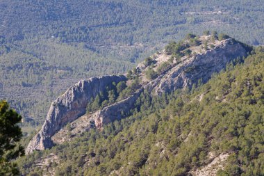 Landscape with the medieval site of the Atalaya de el Castellar from the top of San Cristobal in Alcoy, Spain clipart