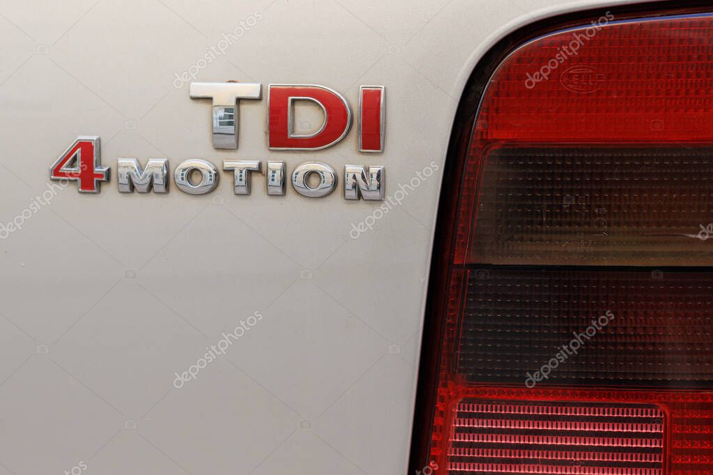 Alcoy, Spain, 11-19-2024: Volkswagen TDI emblem next to the rear light of the car