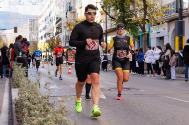 Alcoy, Spain, 12-15-2024: Participants of the Alcoy 2024 half marathon clipart