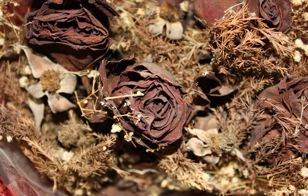 A bouquet of dried roses that have stale over time