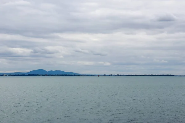 stock image View of sea off city of Geelong with You Yangs mountain range in the background