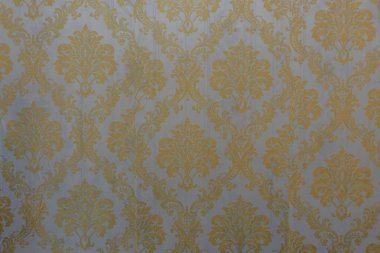 Bu çarpıcı altın duvar deseninin zenginliğini deneyimleyin, entelektüellik ve sonsuz zarafeti..