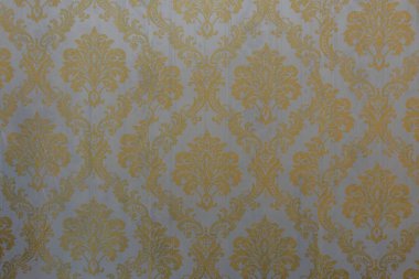 Bu çarpıcı altın duvar deseninin zenginliğini deneyimleyin, entelektüellik ve sonsuz zarafeti..