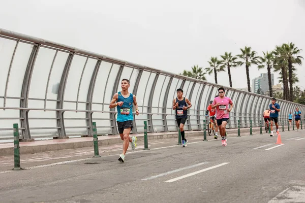 stock image Lima, Peru - May 21, 2023: Running athletes which competing in the Lima Marathon 42K 2023