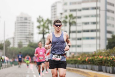 Lima, Peru - May 21, 2023: Athletes compete in the Lima Marathon 42K 2023 clipart