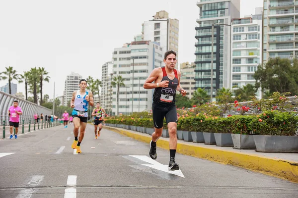 stock image Athletes compete in the Lima Marathon 42K 2023. Running on the road, Lima Peru