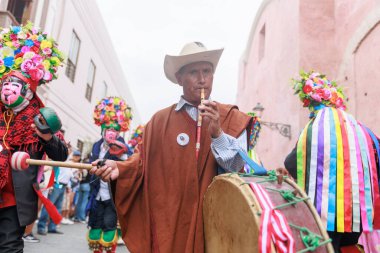 Dancers of the Ancash region with their typical costumes in the parade in the historical center of Lima, Peru. clipart