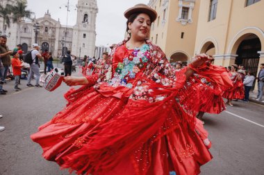 Dancers in the traditional parade for the Festivity of the Virgin of Candelaria in the historical center of Lima, Peru. November 18, 2023.  clipart