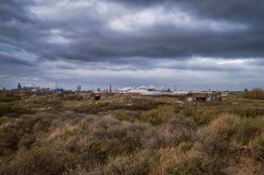 Ijmuiden,North Holland, Netherlands,April 24 2024: Harbour and Tata Steel is one of the largest steelmaking companies in the world clipart