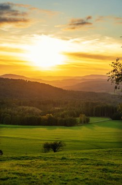 view of the National park Ceske Svycarsko or Czech Switzerland during autumn sunset or sunrise clipart