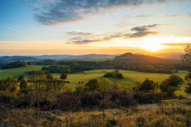 view of the National park Ceske Svycarsko or Czech Switzerland during autumn sunset or sunrise clipart