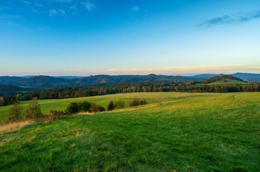 view of the National park Ceske Svycarsko or Czech Switzerland during autumn sunset or sunrise clipart