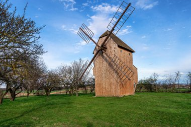 The wooden windmill near Stary Poddvorov, Czech republic. Spring time clipart