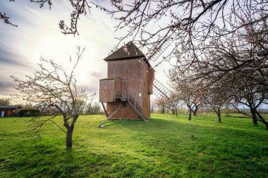 The wooden windmill near Stary Poddvorov, Czech republic. Spring time clipart