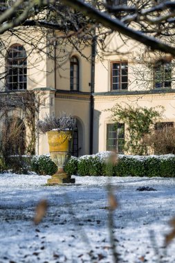 Castolovice, Czech republic -February 16, 2025: Renaissance castle in Castolovice, Czech Republic, snow around the castle and in the parkult. Winter sunny morning around the castle and in the park. clipart