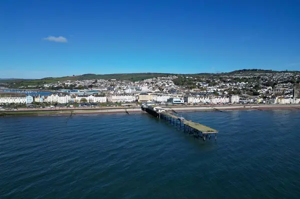 stock image Teignmouth, South Devon, England: DRONE VIEW: The Grand Pier, the town of Teignmouth and the River Teign in the background. Teignmouth is both a port town and a popular English holiday destination (PHOTO 2).