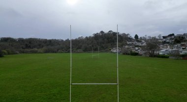 Paignton, South Devon, England: DRONE VIEW: A view of a rugby union pitch through both sets of goalposts. The pitch is a part of the Clennon Valley playing fields.