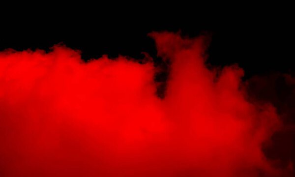 Abstract Red smoke on black background.Dramatic smoke clouds.Movement of colorful smoke.Freeze motion of powder exploding isolated on Black background.Abstract design of red dust cloud.Particles explosion screen saver,wallpaper.smoke abstract.