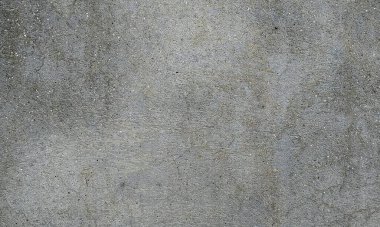 Soyut boya binanın duvarından soyuluyor. Yakın plan. Boya ve çatlaklarla kaplı kötü tamir edilmiş ön bina duvarı. Ortadaki boya parçası kayıp, kanatlı çatlak. Çizik ve çatlaklarla duvar dokusu. Kusursuz gri beton..