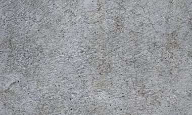 Parlak boya ve yıpranmış parçalarla eski beton duvar yüzeyinin soyut arkaplanı. Güzel Soyut Grunge Dekoratif Karanlık Stucco Duvarı Arkaplanı. Sanat pürüzlü Stylize Doku. Aşınmış bej renkli, çizik parmaklarla kaplanmış yıpranmış beton duvar.