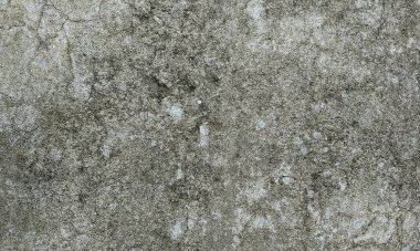 Parlak boya ve yıpranmış parçalarla eski beton duvar yüzeyinin soyut arkaplanı. Güzel Soyut Grunge Dekoratif Karanlık Stucco Duvarı Arkaplanı. Sanat pürüzlü Stylize Doku. Aşınmış bej renkli, çizik parmaklarla kaplanmış yıpranmış beton duvar.