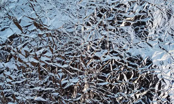 Buruşmuş folyo ile soyut doku, yakın görünüm 