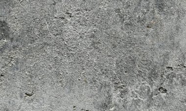 Soyut Taş Duvar arka plan, çimento efektli taşralı mermer dokusu, gri renk desenli doğal mermer figür, kum desenli. Geniş kaba beton duvar dokusu. Boş sert çimento yüzeyinin arka planı. Duvardaki çizikler çatlaklar..