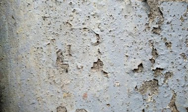 Soyut Taş Duvar arka plan, çimento efektli taşralı mermer dokusu, gri renk desenli doğal mermer figür, kum desenli. Geniş kaba beton duvar dokusu. Boş sert çimento yüzeyinin arka planı. Duvardaki çizikler çatlaklar..