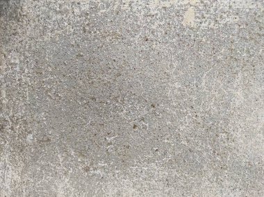 Soyut Taş Duvar arka plan, çimento efektli taşralı mermer dokusu, gri renk desenli doğal mermer figür, kum desenli. Geniş kaba beton duvar dokusu. Boş sert çimento yüzeyinin arka planı. Duvardaki çizikler çatlaklar..