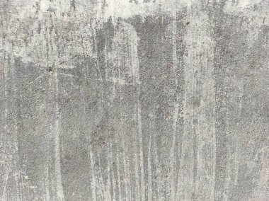 Soyut Taş Duvar arka plan, çimento efektli taşralı mermer dokusu, gri renk desenli doğal mermer figür, kum desenli. Geniş kaba beton duvar dokusu. Boş sert çimento yüzeyinin arka planı. Duvardaki çizikler çatlaklar..