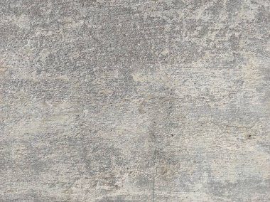 Soyut Taş Duvar arka plan, çimento efektli taşralı mermer dokusu, gri renk desenli doğal mermer figür, kum desenli. Geniş kaba beton duvar dokusu. Boş sert çimento yüzeyinin arka planı. Duvardaki çizikler çatlaklar..