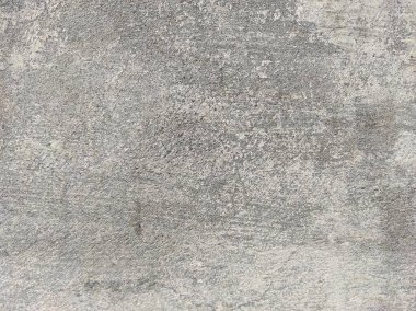 Soyut Taş Duvar arka plan, çimento efektli taşralı mermer dokusu, gri renk desenli doğal mermer figür, kum desenli. Geniş kaba beton duvar dokusu. Boş sert çimento yüzeyinin arka planı. Duvardaki çizikler çatlaklar..